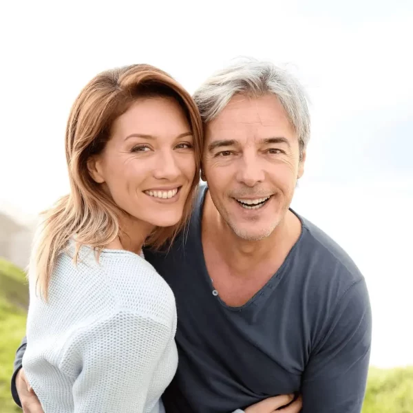 A man and woman smiling for a picture